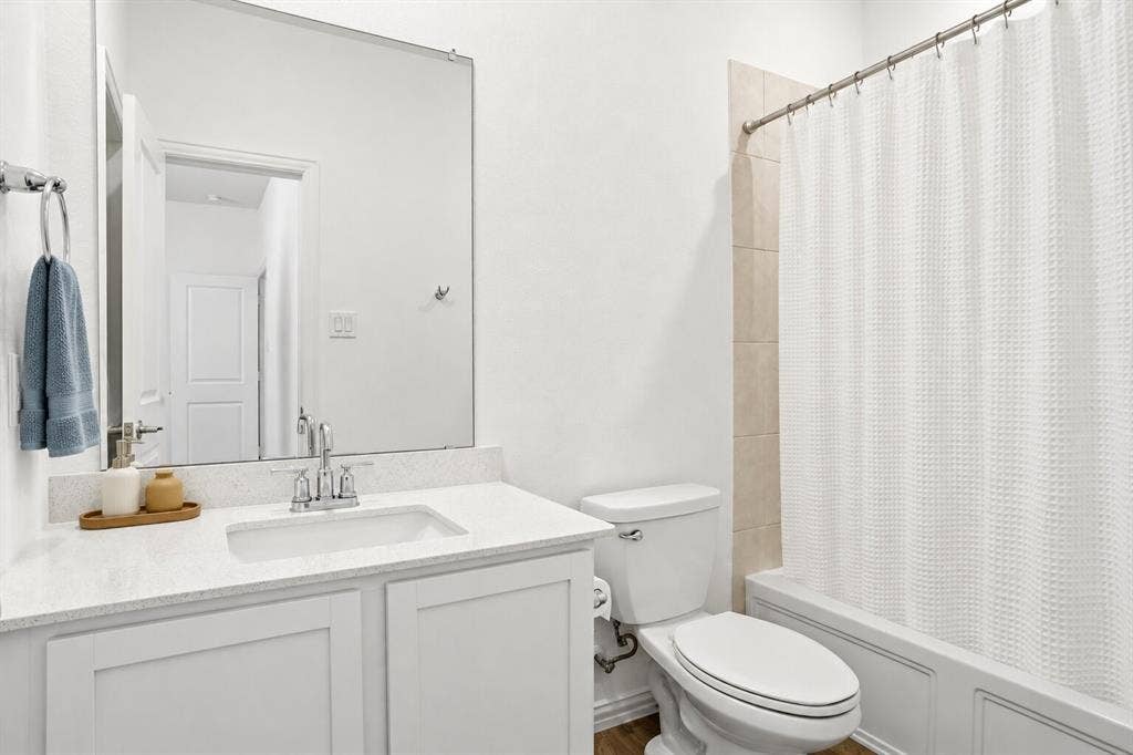 317 Red Cedar Drive, Princeton, TX 75407 En suite bathroom to secondary bedroom; Photo has been digitally enhanced and/or virtually staged using AI.