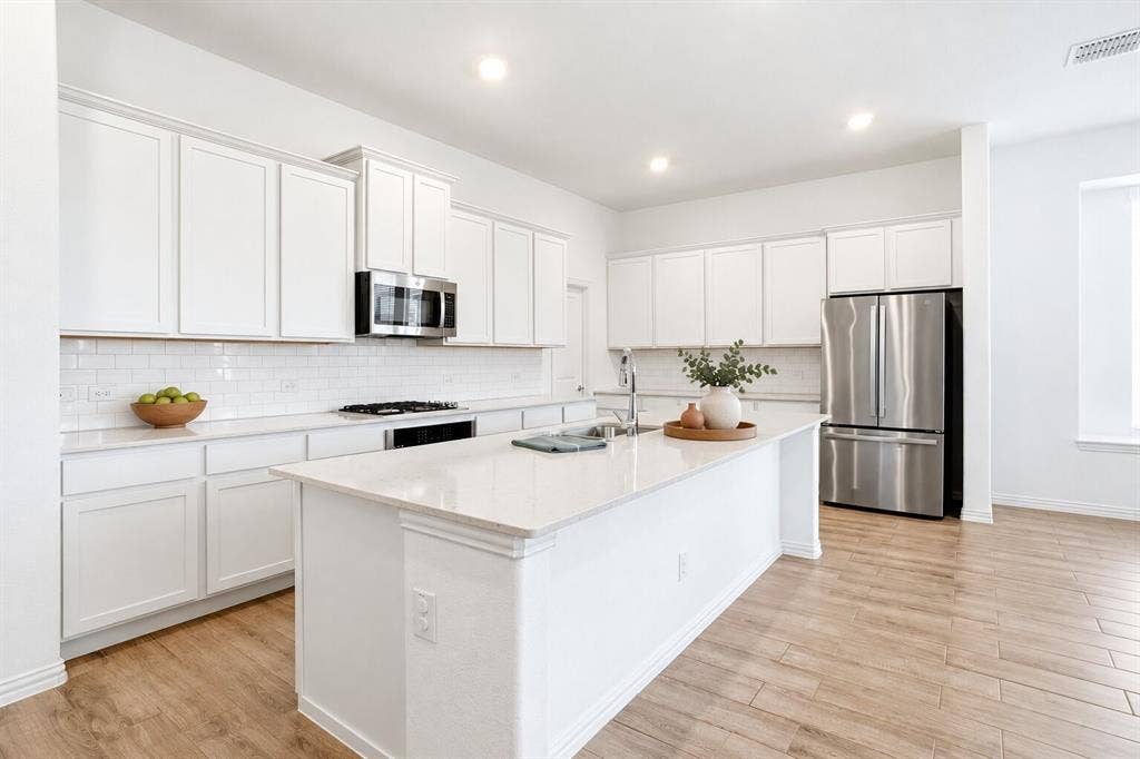 317 Red Cedar Drive, Princeton, TX 75407 Kitchen; Photo has been digitally enhanced and/or virtually staged using AI.