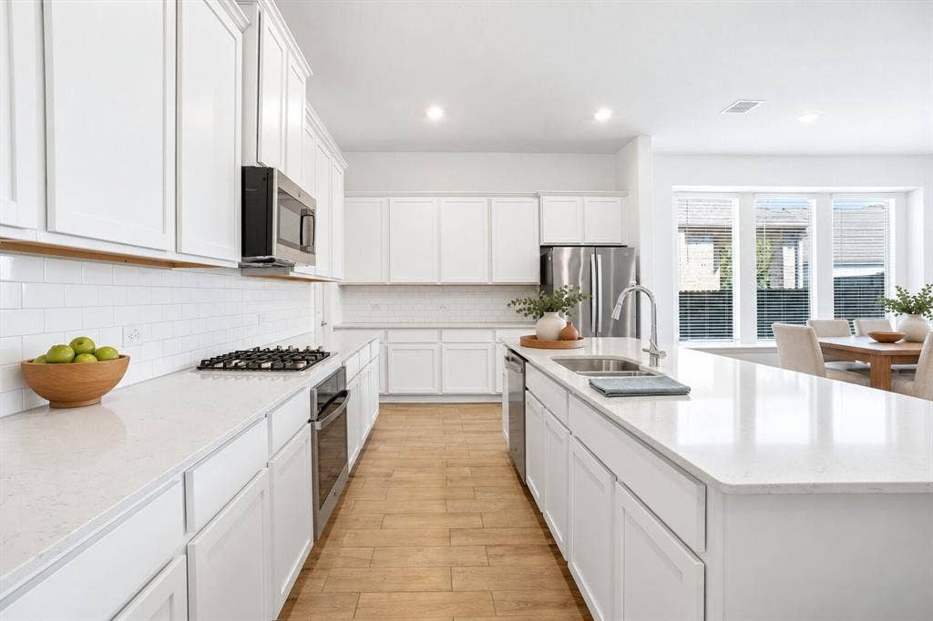 317 Red Cedar Drive, Princeton, TX 75407 Kitchen; Photo has been digitally enhanced and/or virtually staged using AI.