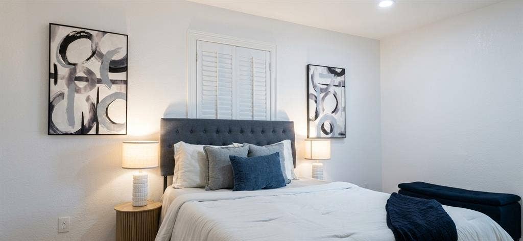 513 Vernet Street, Richardson, TX 75080 Bedroom featuring white walls, recessed ceiling lighting, and plantation shutters