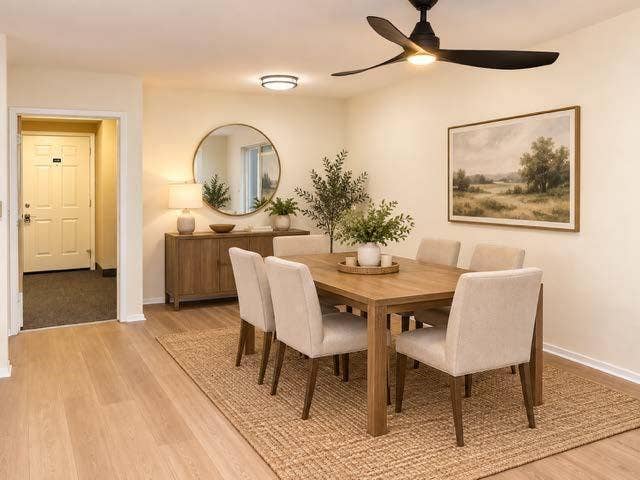 11450 Audelia Road, #104, Dallas, TX 75243 Stages Neutral-toned interior space featuring light wood-finish flooring, a contemporary three-blade matte black ceiling fan with integrated lighting, and a flush-mount circular ceiling fixture