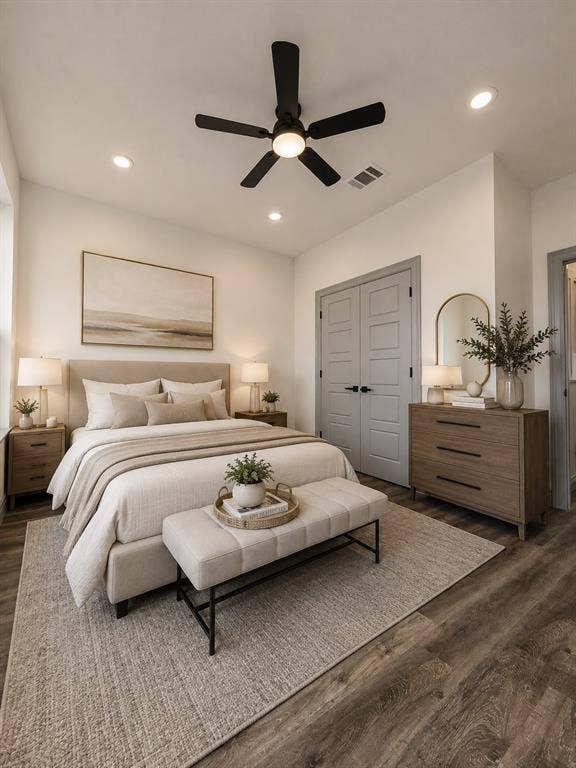 Wood-finish flooring, recessed lighting, matte black ceiling fan, and grey shaker-style interior doors with matte black hardware
