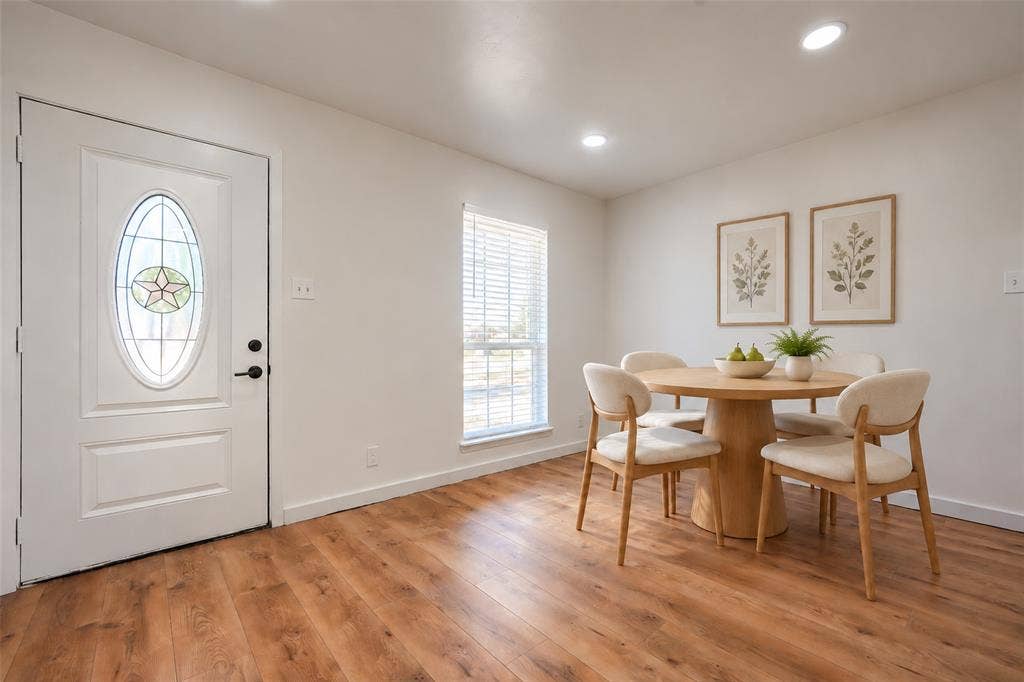 Entryway featuring wood-finish flooring, recessed lighting, and an exterior door with a decorative oval glass insert
