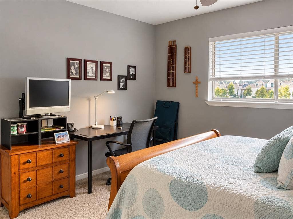 7730 Meadow Park Drive, #222, Dallas, TX 75230 Neutral-toned interior featuring carpeted flooring and a multi-pane window with horizontal blinds