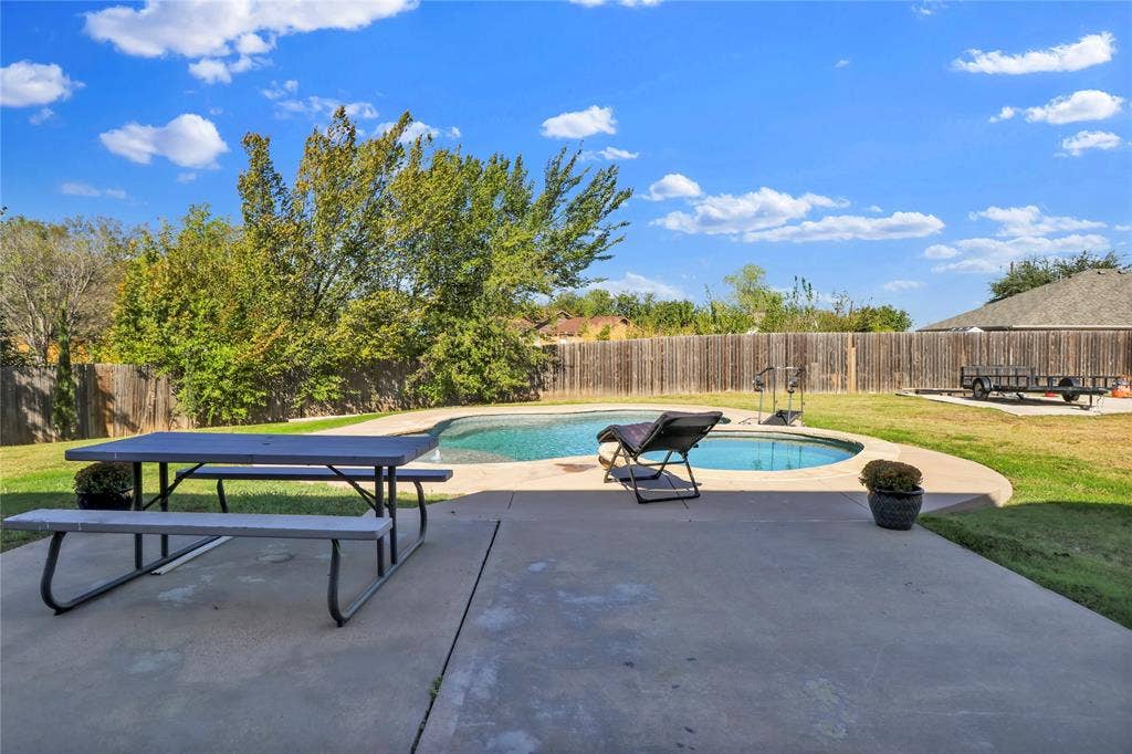 5753 Lionfish Way, Fort Worth, TX 76131 Large back yard with pool and spa. Notice the parking space for boat, trailer or RV.