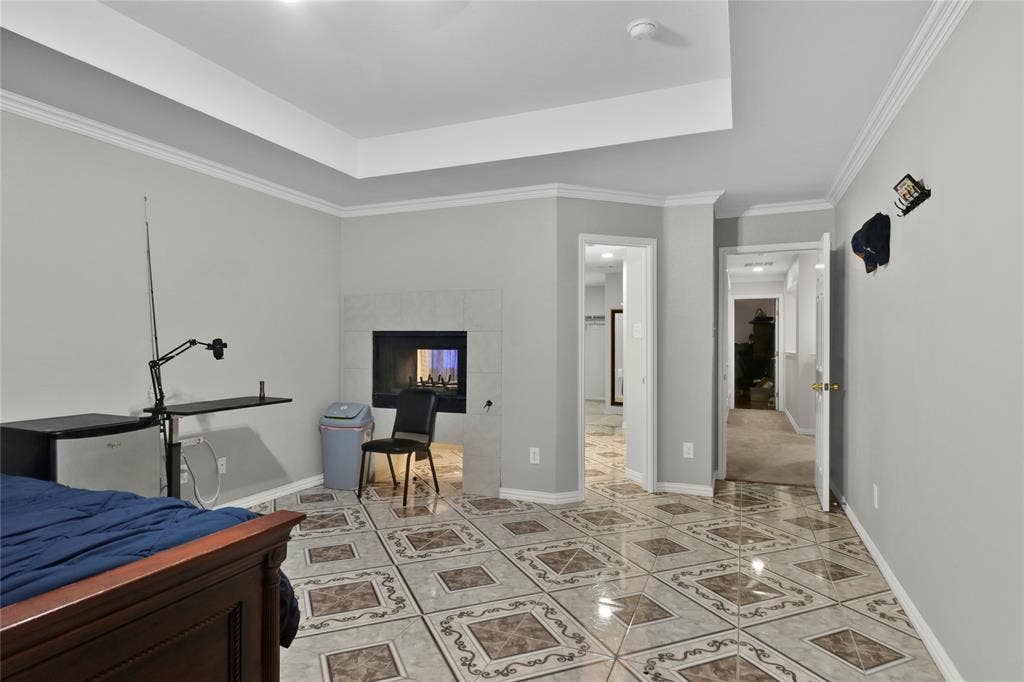 5753 Lionfish Way, Fort Worth, TX 76131 Master suite with double sided fireplace.