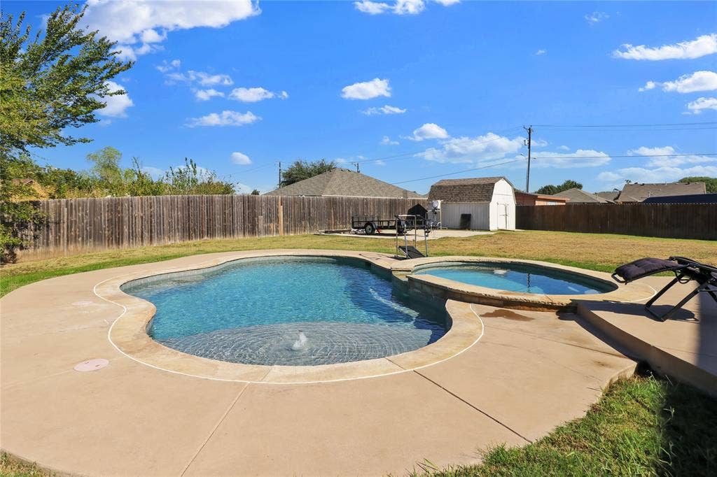 5753 Lionfish Way, Fort Worth, TX 76131 Pool and view of storage building.