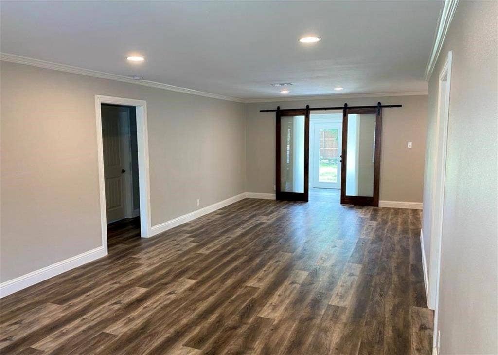 4906 W Mockingbird Lane, Dallas, TX 75209 Great room / Living & Dining combination. View from front door and barn doors enter bonus space