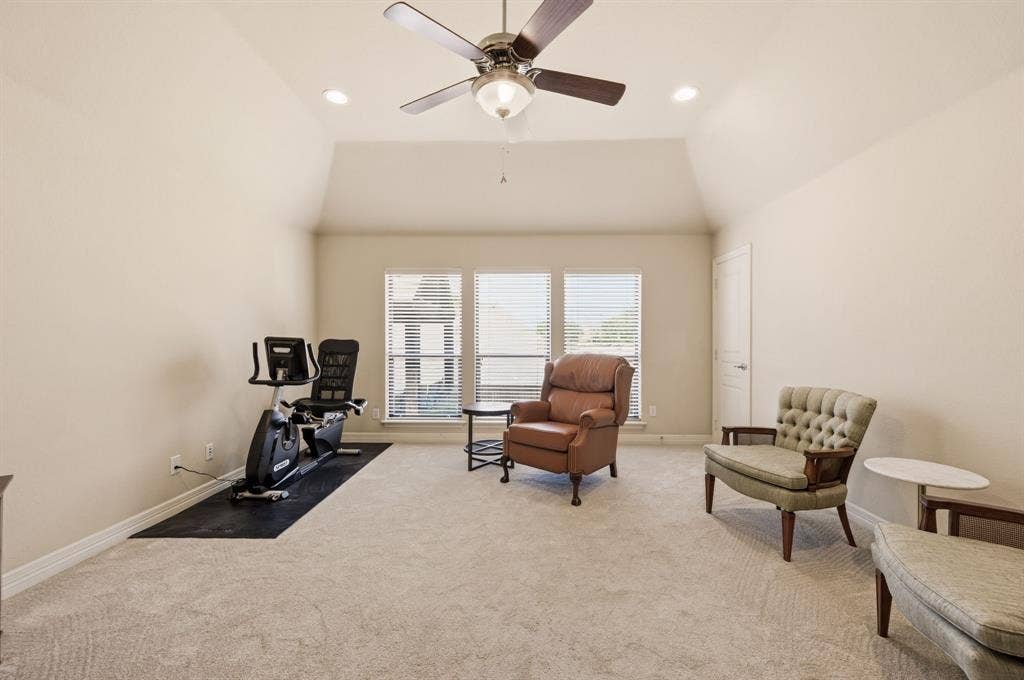 Vaulted ceiling, carpeting, recessed lighting, central ceiling fan, and triple windows