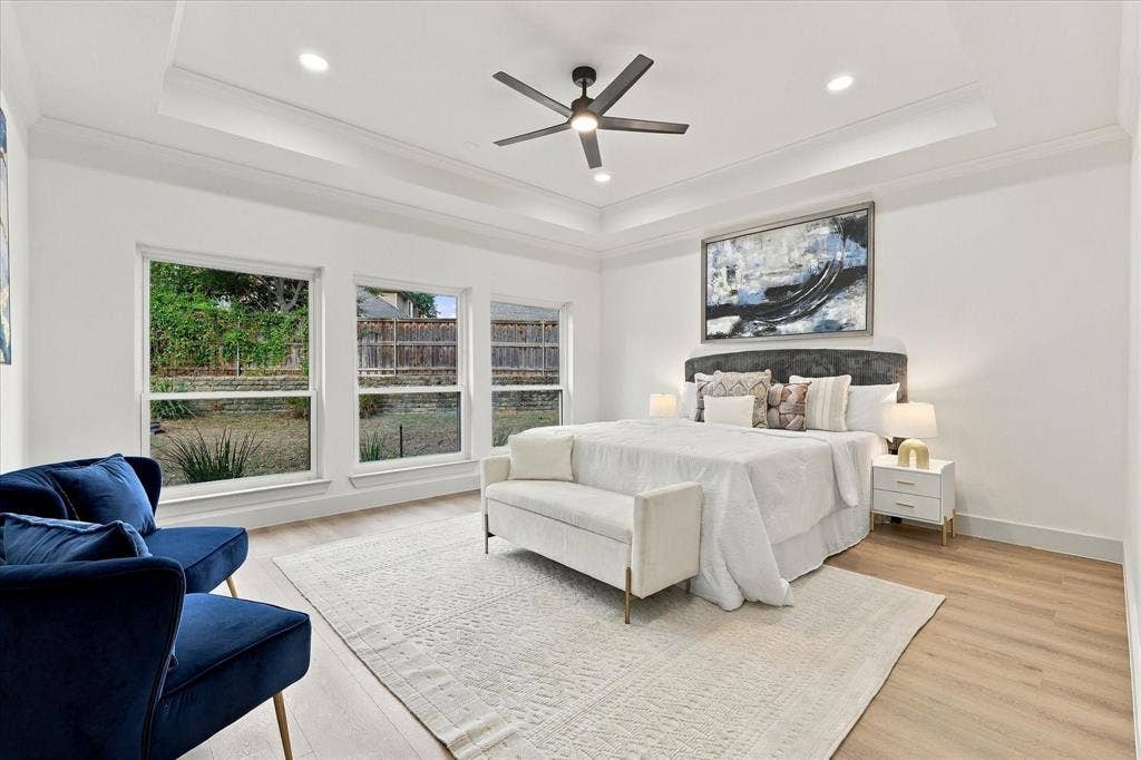 5609 Hillview Court, McKinney, TX 75072 Tray ceiling with recessed lighting, wood-finish flooring, and expansive windows