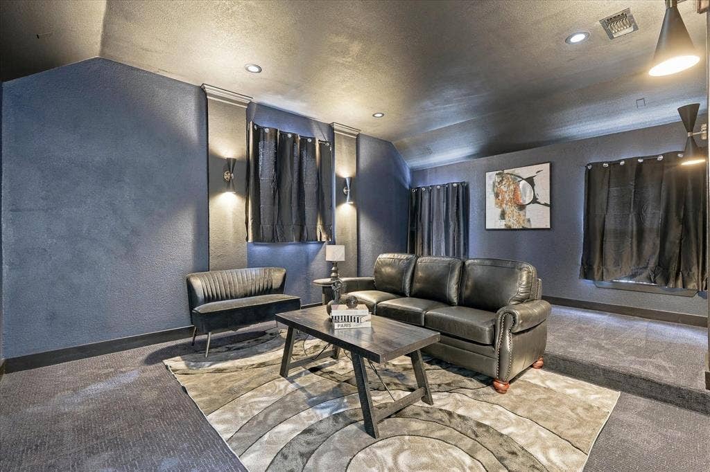 5609 Hillview Court, McKinney, TX 75072 Room featuring vaulted ceilings, recessed lighting, wall-mounted sconces, and dual-level flooring