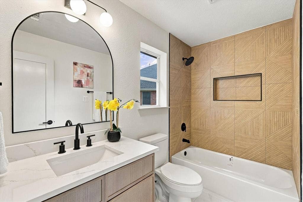 5609 Hillview Court, McKinney, TX 75072 Bathroom featuring a vanity with white stone-finish countertop, undermount sink, and matte black faucet