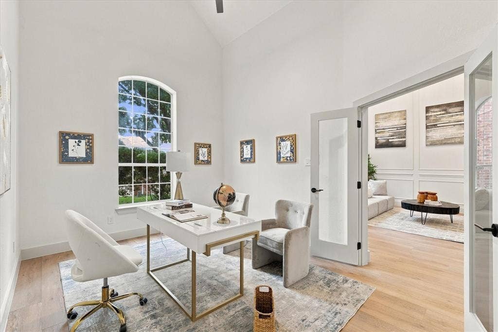 5609 Hillview Court, McKinney, TX 75072 Vaulted ceilings, arched window, wood-finish flooring, and glass-paneled double doors