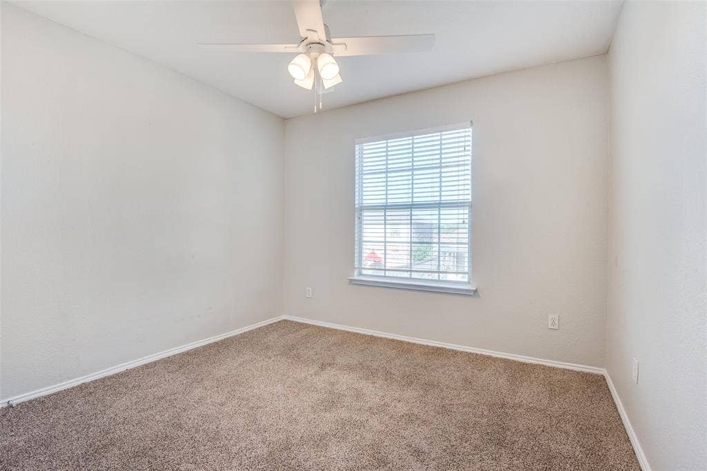 5329 Raven Row, Dallas, TX 75236 Carpeted empty room with ceiling fan