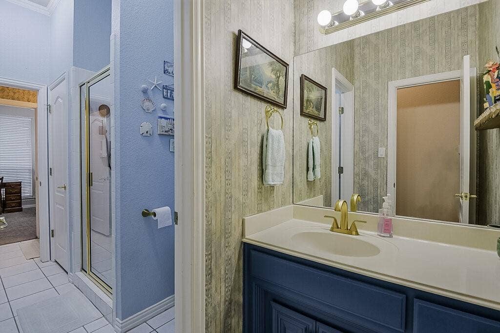 Hall bathroom with shower just off the entry and 1st bedroom