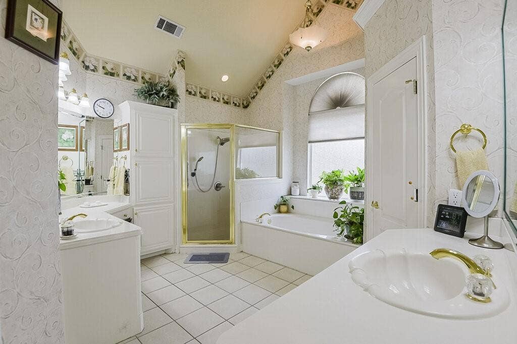 Lovely primary bath, spacious with lots of natural light coming through.