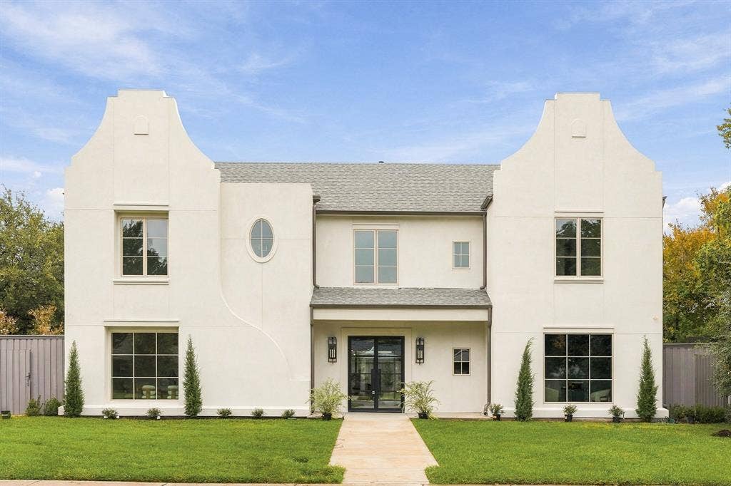 4953 Forest Bend Road, Dallas, TX 75244 Stucco exterior featuring dual stepped gables, an oval accent window, multi-light grid windows, and a covered entryway