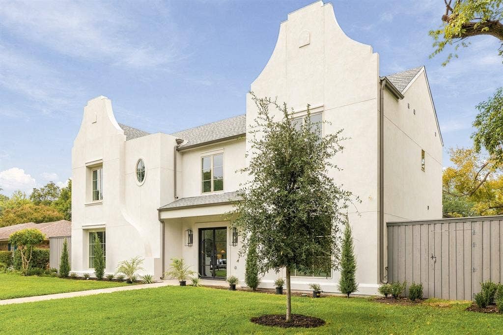 4953 Forest Bend Road, Dallas, TX 75244 Stucco exterior featuring dual stepped gables, an oval window, and grid-patterned windows
