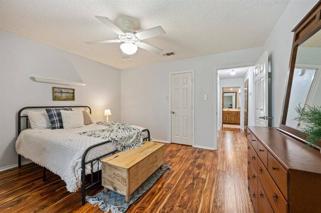 339 Park North Lane, Keller, TX 76248 Wood-finish flooring, ceiling fan with integrated lighting, and multiple interior paneled doors