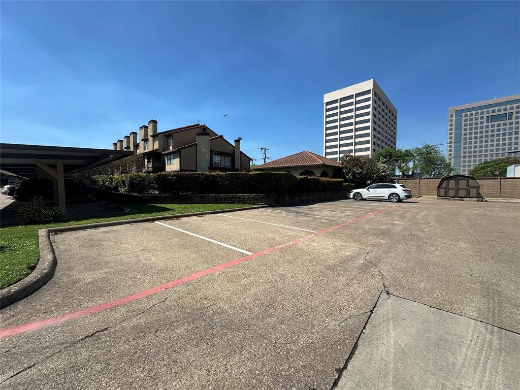 5757 E University Boulevard, #27p, Dallas, TX 75206 Paved surface lot with marked parking stalls and covered parking structures