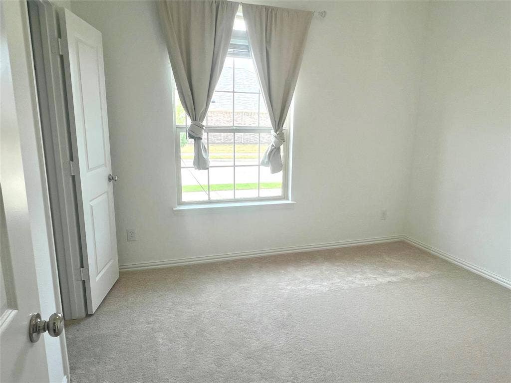 412 Ardsley Lane, Princeton, TX 75407 View of carpeted spare room