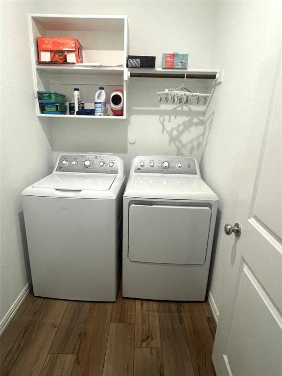 412 Ardsley Lane, Princeton, TX 75407 Washroom with separate washer and dryer and hardwood / wood-style flooring