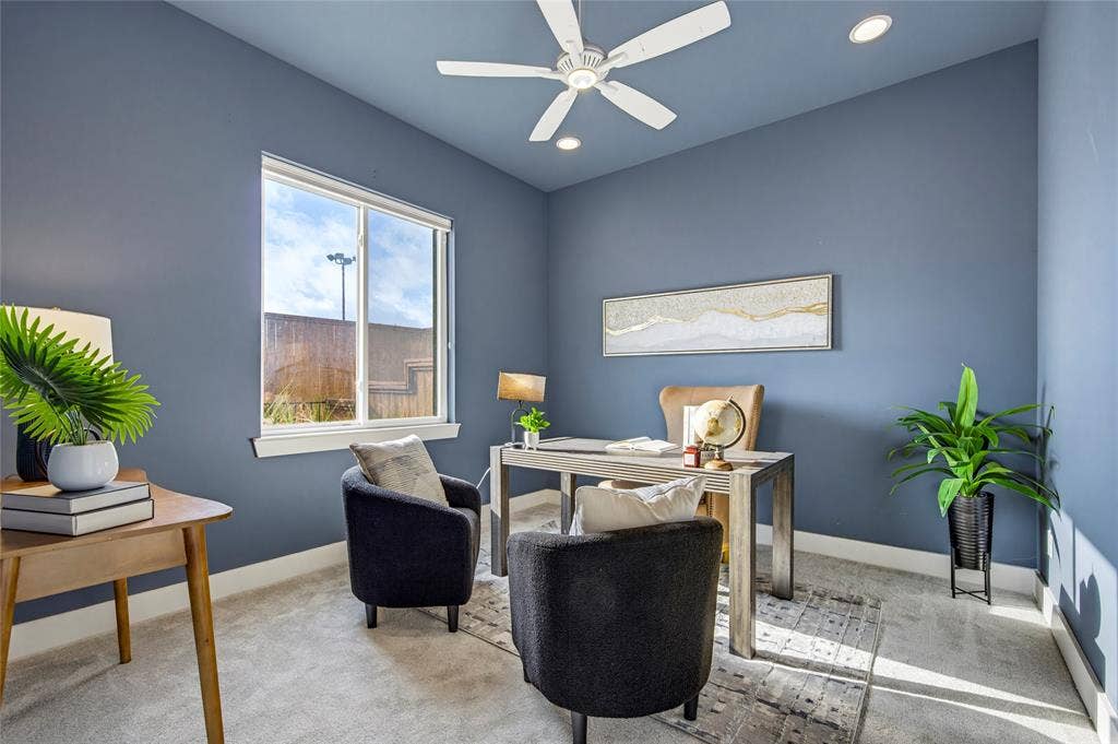 Room featuring neutral carpeting, a white ceiling fan with integrated lighting, recessed lighting, and a single-pane window