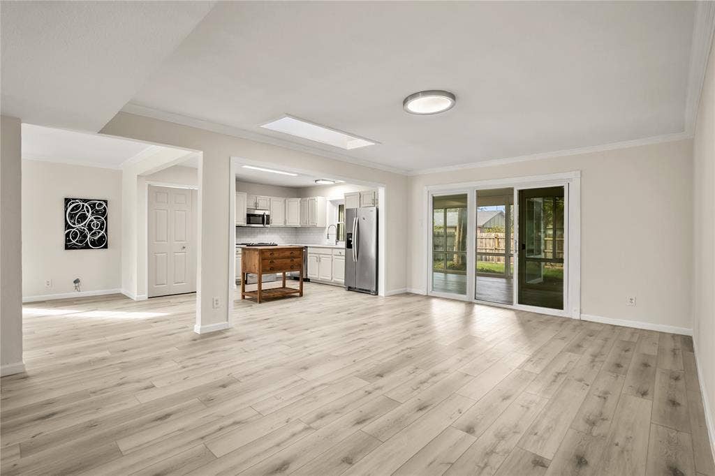 310 Glendale Drive, Grand Prairie, TX 75052 Open to Kitchen, Living Room and Sun Room
