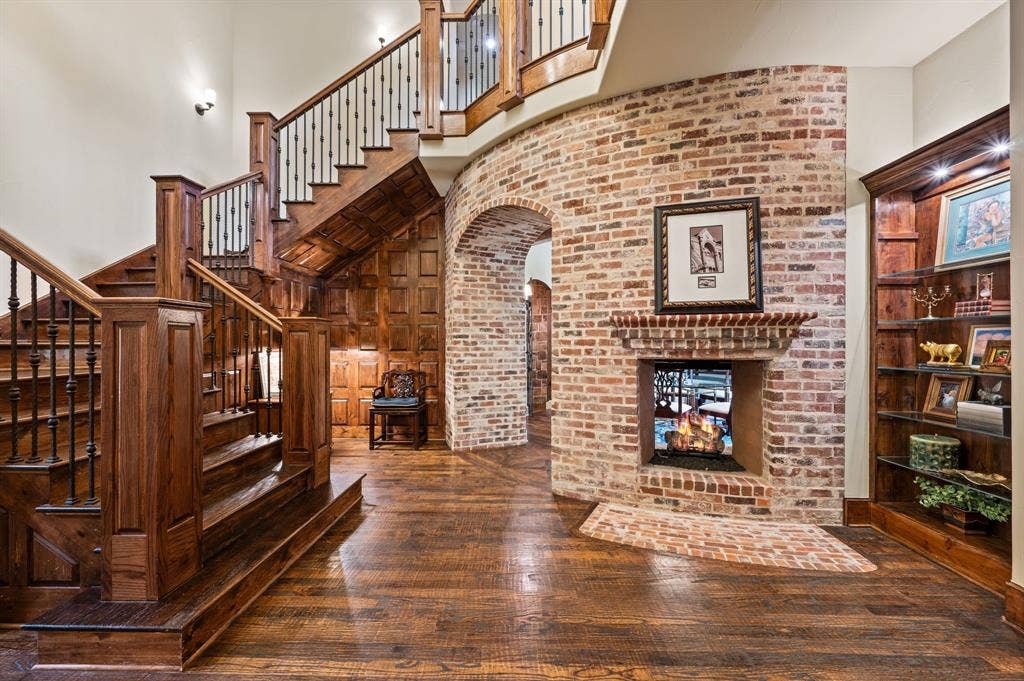 A welcoming entry foyer showcases exquisite custom millwork and antique Chicago brick accents, setting the tone for the home’s timeless character and architectural charm.