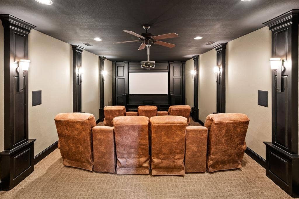 The perfect setting for movie nights and entertaining, this dedicated media room offers comfortable seating for seven and an inviting cinematic experience.