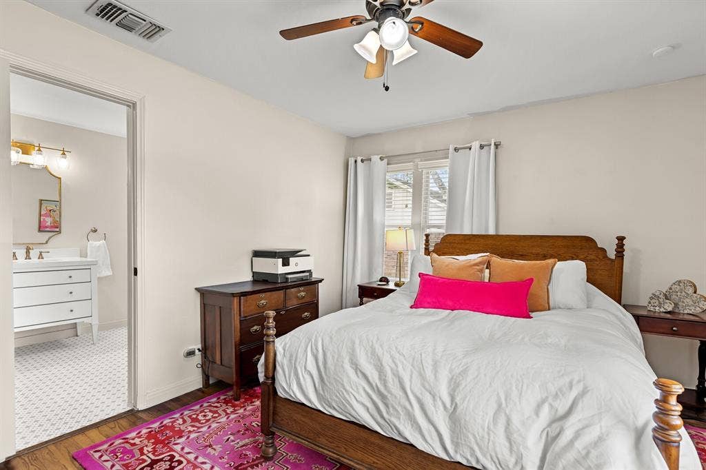 2425 S 2nd Street, Waco, TX 76706 Bedroom featuring wood-finish flooring and a ceiling fan with light fixture