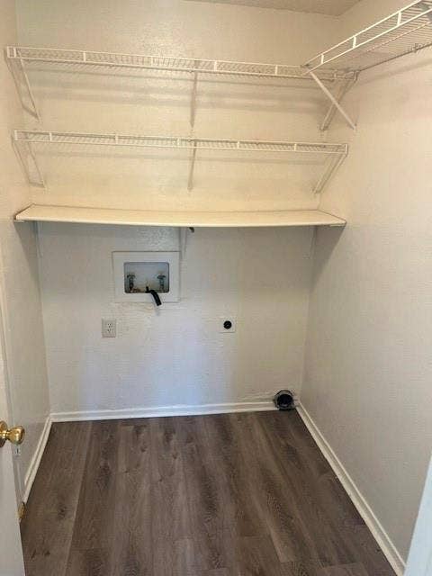 1236 Neptune Drive, Cedar Hill, TX 75104 Dedicated utility area featuring wood-finish flooring, built-in tiered wire shelving, and an integrated solid surface shelf