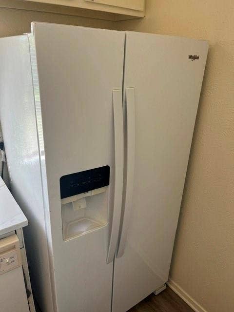 1236 Neptune Drive, Cedar Hill, TX 75104 White side-by-side refrigerator featuring an integrated door-mounted ice and water dispenser