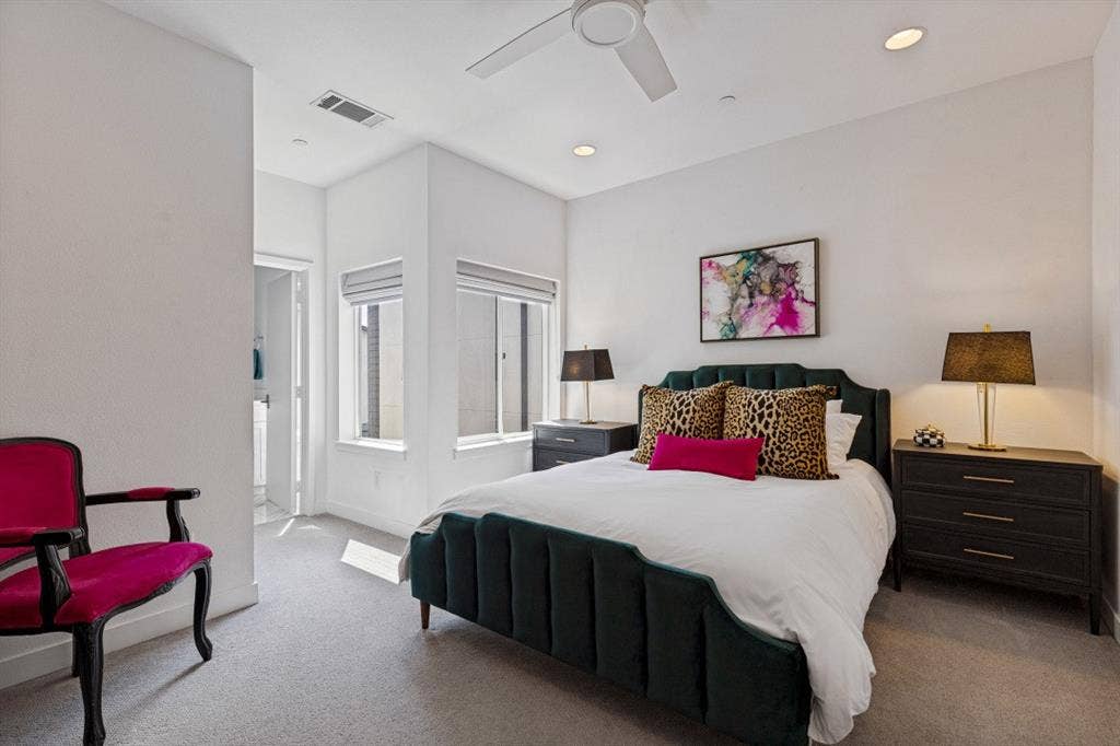2107 Bennett Avenue, #20, Dallas, TX 75206 Neutral-toned carpeting, recessed ceiling lighting, dual windows with fitted shades, and a ceiling fan