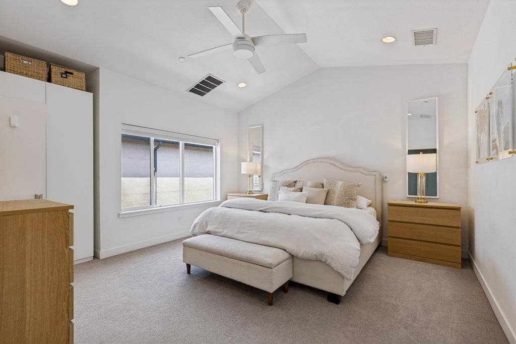 2107 Bennett Avenue, #20, Dallas, TX 75206 Vaulted ceiling featuring a central white paddle fan, recessed lighting, neutral carpeting, and built-in white wardrobe cabinetry