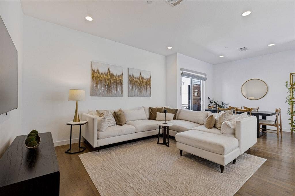 2107 Bennett Avenue, #20, Dallas, TX 75206 Open-concept interior featuring wood-finish flooring, recessed lighting, and sliding glass doors