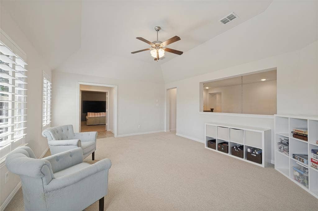 301 Longhorn Drive, McKinney, TX 75071 Upstairs game room with a wet bar, offering additional space for relaxing and entertaining.