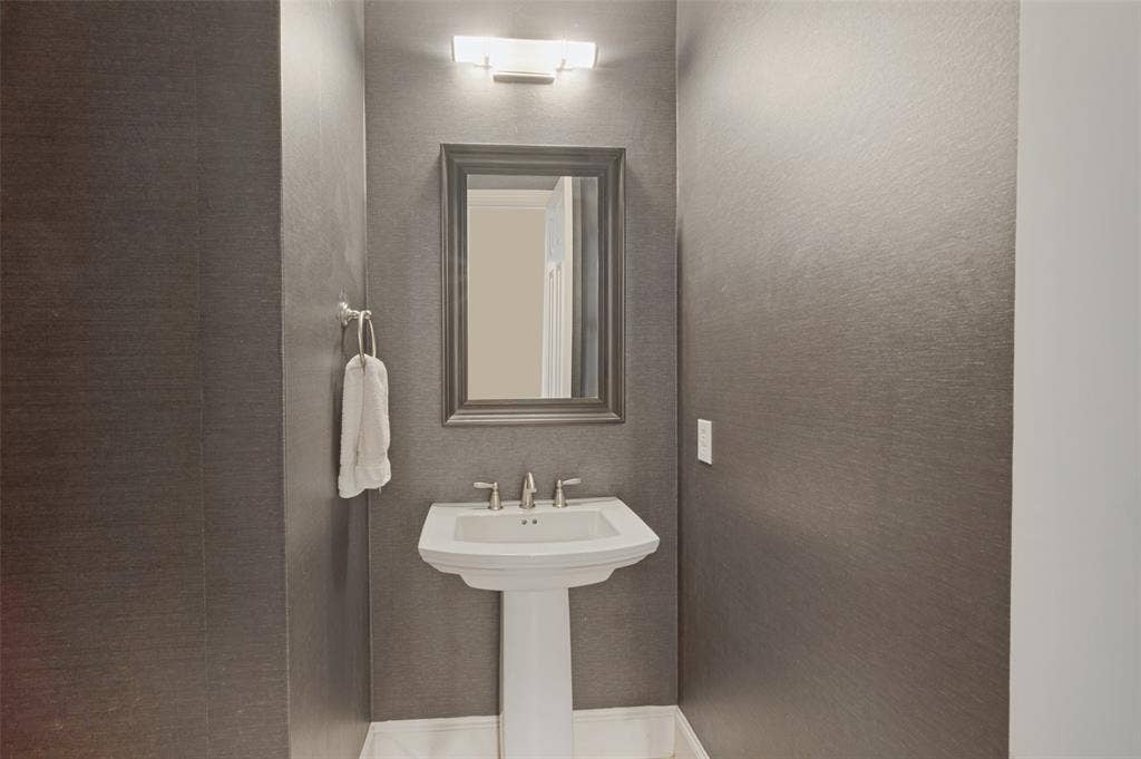 301 Longhorn Drive, McKinney, TX 75071 1st floor half bath for guest.