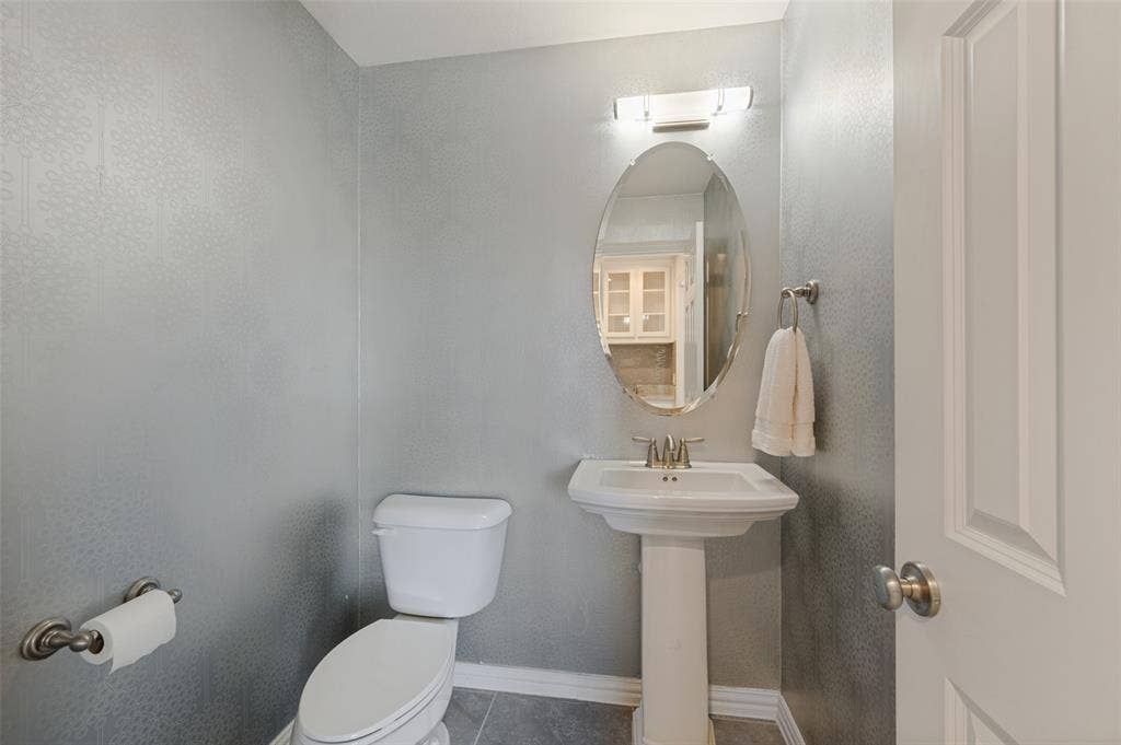 301 Longhorn Drive, McKinney, TX 75071 Dedicated media room with a convenient half bath nearby.