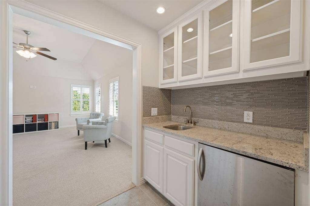 301 Longhorn Drive, McKinney, TX 75071 Convenient wet bar located between the game room and media room.