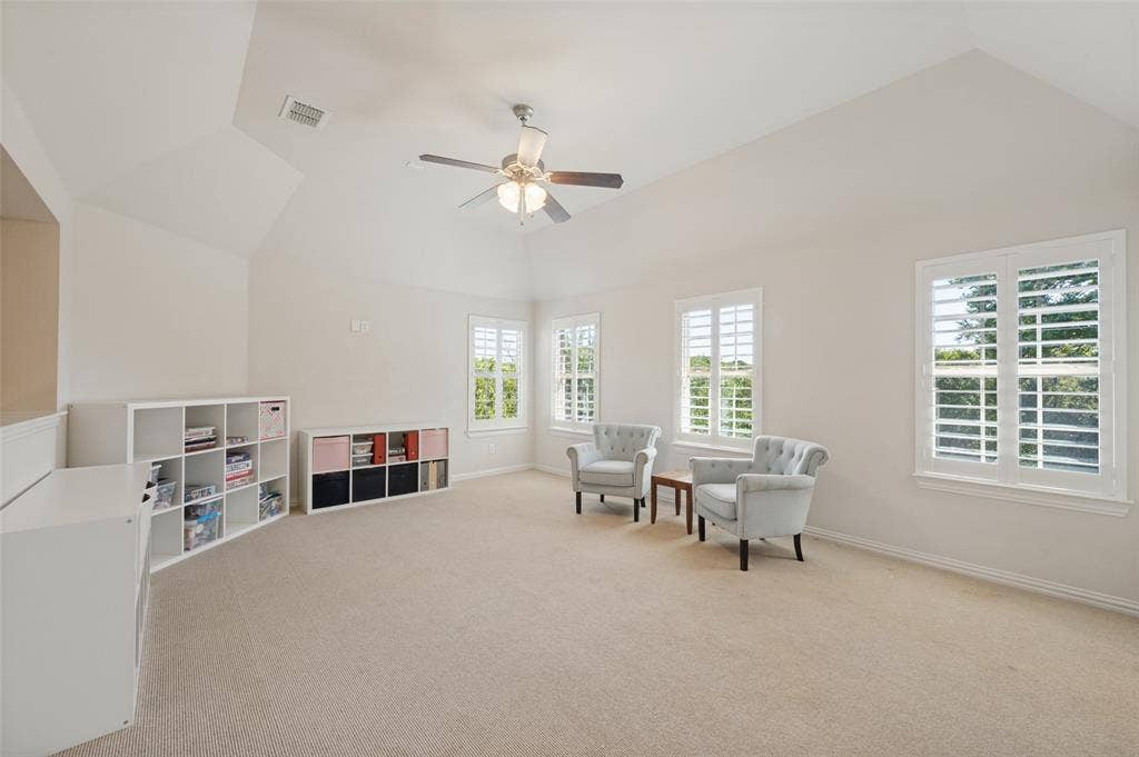 301 Longhorn Drive, McKinney, TX 75071 Upstairs game room with a wet bar, offering additional space for relaxing and entertaining.