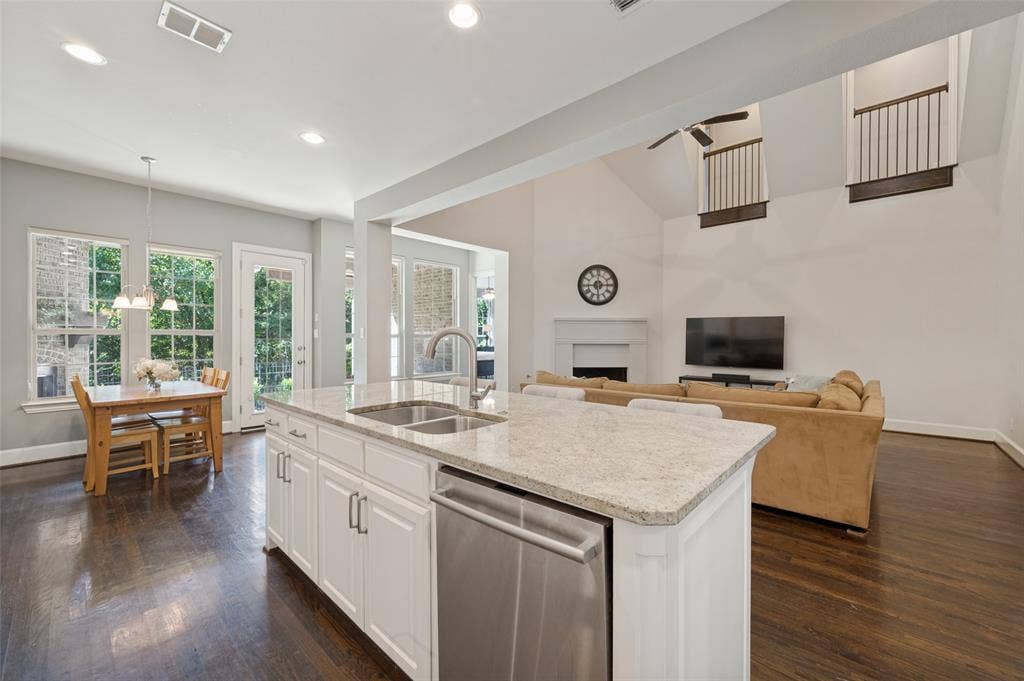 301 Longhorn Drive, McKinney, TX 75071 Chef’s kitchen with a large center island, five burner gas cooktop, double ovens, range hood and butler’s pantry.