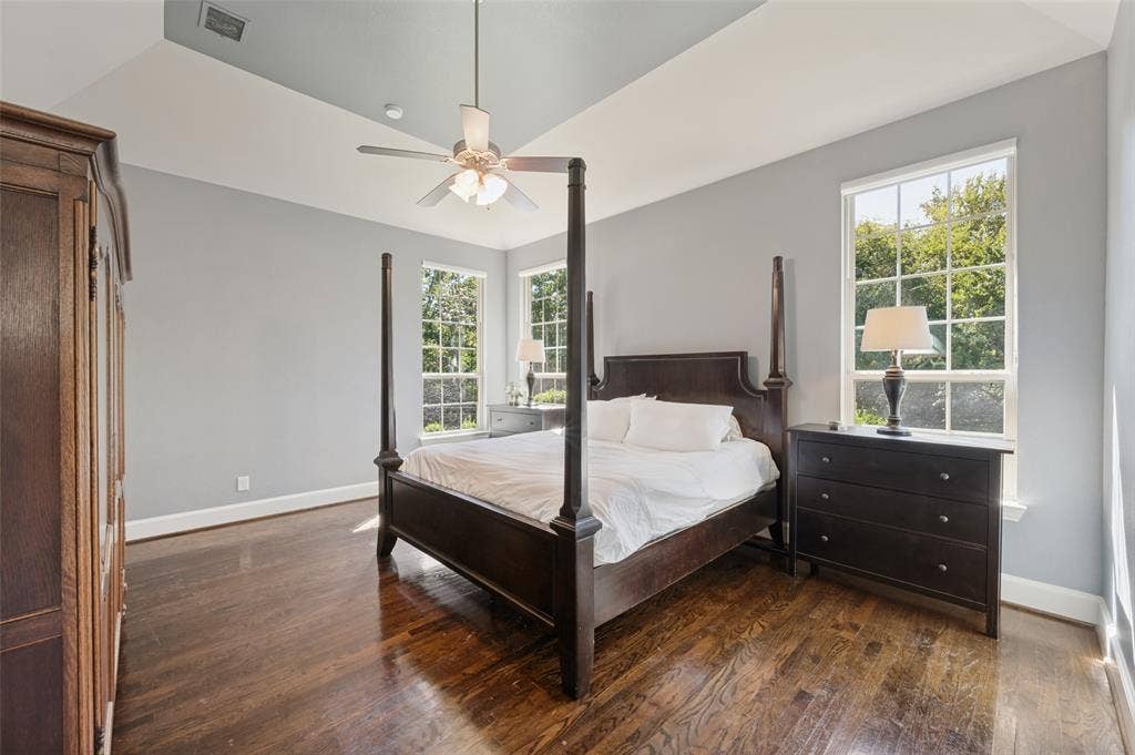 301 Longhorn Drive, McKinney, TX 75071 First floor primary suite with generous space and an ensuite bath featuring separate vanities, a soaking tub and separate shower.