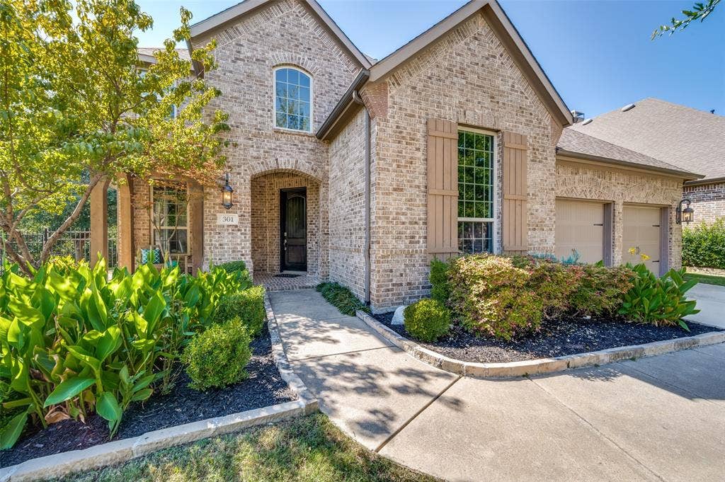 301 Longhorn Drive, McKinney, TX 75071 Curb appeal, a cul de sac location and a three car garage.