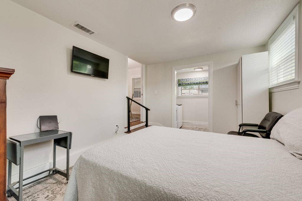 2815 Anzio Drive, Dallas, TX 75224 Neutral interior room featuring white walls, a flush-mount ceiling light, and window blinds