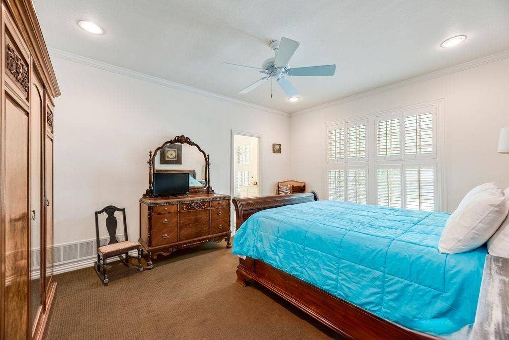 1418 Yakimo Drive, Dallas, TX 75208 Interior room featuring plantation shutters, recessed lighting, and a ceiling fan