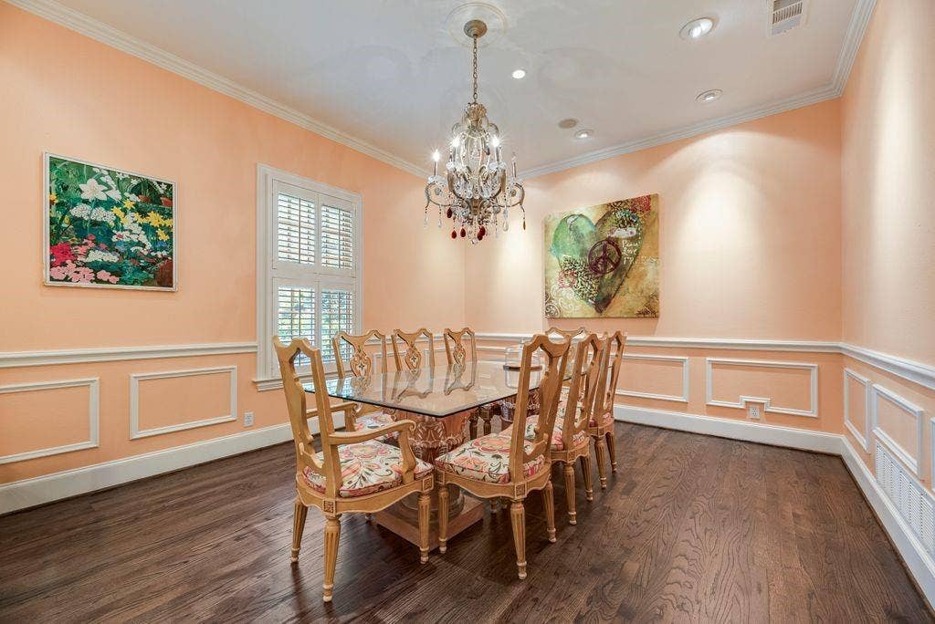 1418 Yakimo Drive, Dallas, TX 75208 Room featuring wood-finish flooring, decorative wall molding, plantation shutters, recessed lighting, and a crystal chandelier