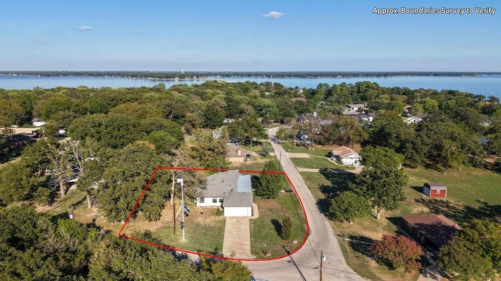 409 Oak Creek Drive, Tool, TX 75143 Aerial view highlighting the corner lot, surrounding neighborhood, and proximity to the lake.