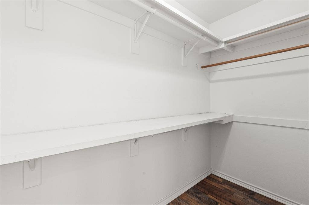 409 Oak Creek Drive, Tool, TX 75143 Ensuite bedroom two large Walk-in closet with built-in shelving and hanging rods.