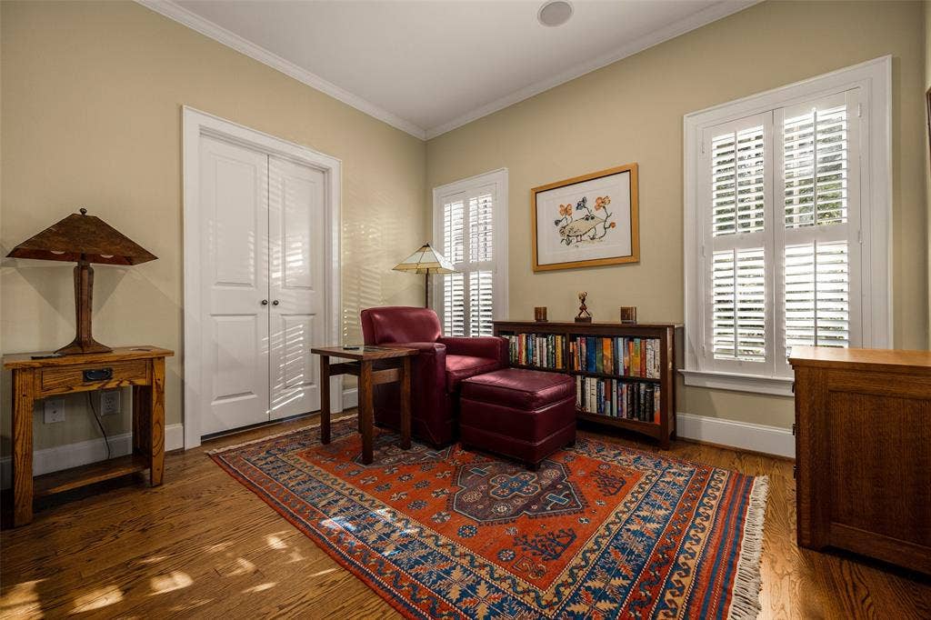 6020 Tremont Street, Dallas, TX 75214 Room featuring wood-finish flooring, white plantation shutters, and dual-panel interior doors